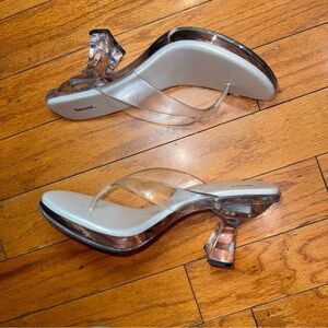 Clear and silver thing/flip flops heels 
Left heel does light up
